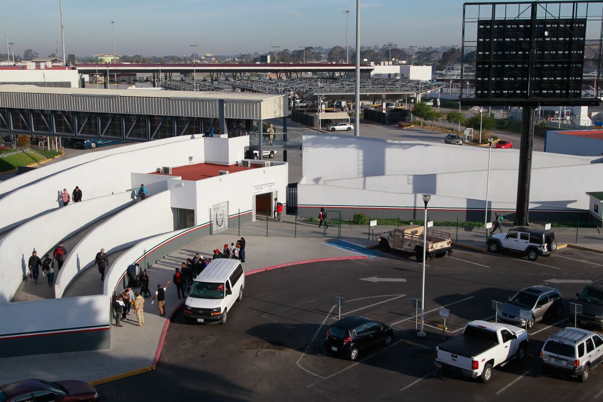 A van with migrants seeking asylum in the U.S. in April 2019 at El Chaparral border crossing in Tijuana.