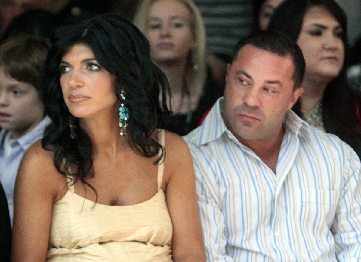 Teresa Giudice, left, and husband Giuseppe "Joe" Giudice, stars of "The Real Housewives of New Jersey," have been charged in a 39-count indictment.