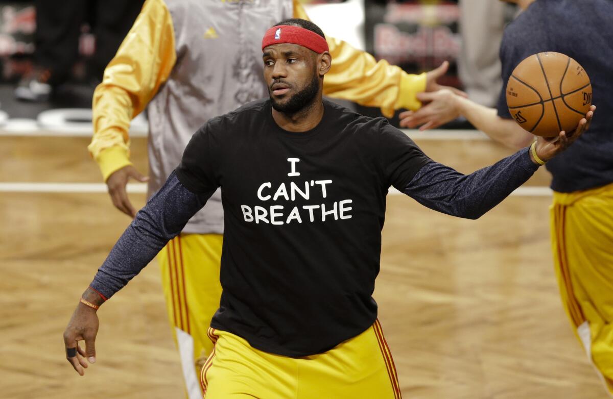 LeBron James wears a T-shirt with the words "I Can't Breathe" during pregame warmups.