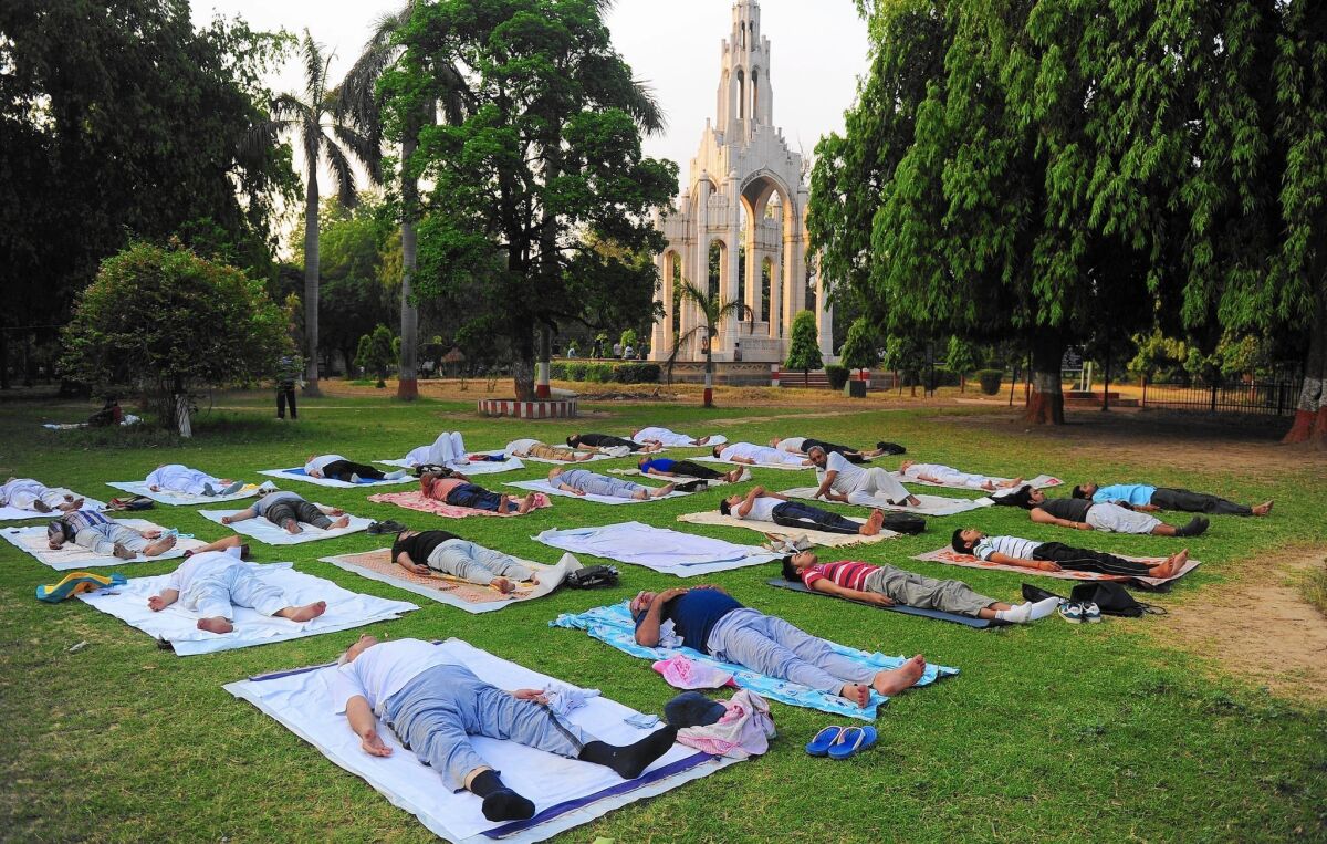 People take part in a yoga workshop in Allahabad, India. The nation is sponsoring events in 191 countries as part of the International Day of Yoga.