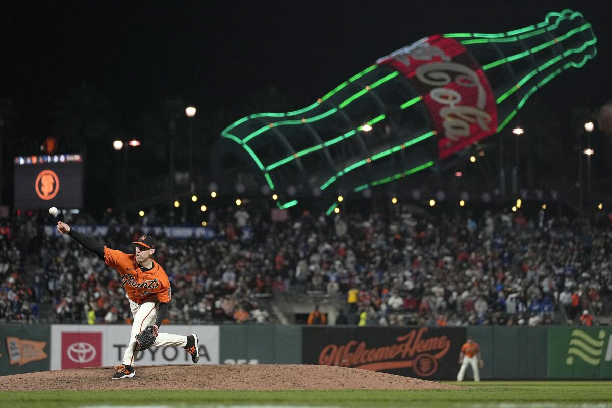 The Giants' Anthony DeSclafani pitches in his team's 3-2, 11-inning win over the Dodgers on Friday in San Francisco.