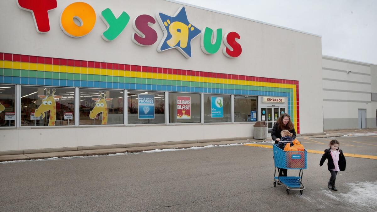 Customers shop at a Toys R Us store in January in Highland Park, Ill. The store is one of more than 180 Toys R Us and Babies R Us stores the company said earlier this year it would close. Now, the entire chain may be shut down.