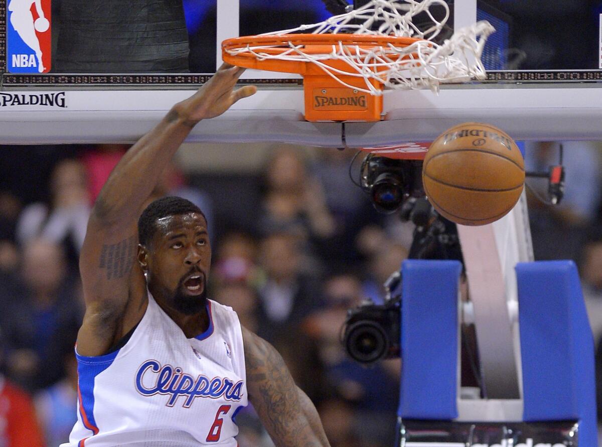 Clippers center DeAndre Jordan dunks during a preseason game against Utah on Oct. 23.