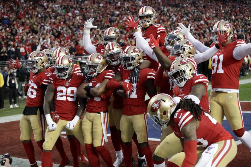 The San Francisco 49ers celebrates after interception by defensive back Emmanuel Moseley (41) during the first half of the NFL NFC Championship football game against the Green Bay Packers Sunday, Jan. 19, 2020, in Santa Clara, Calif. (AP Photo/Marcio Jose Sanchez)