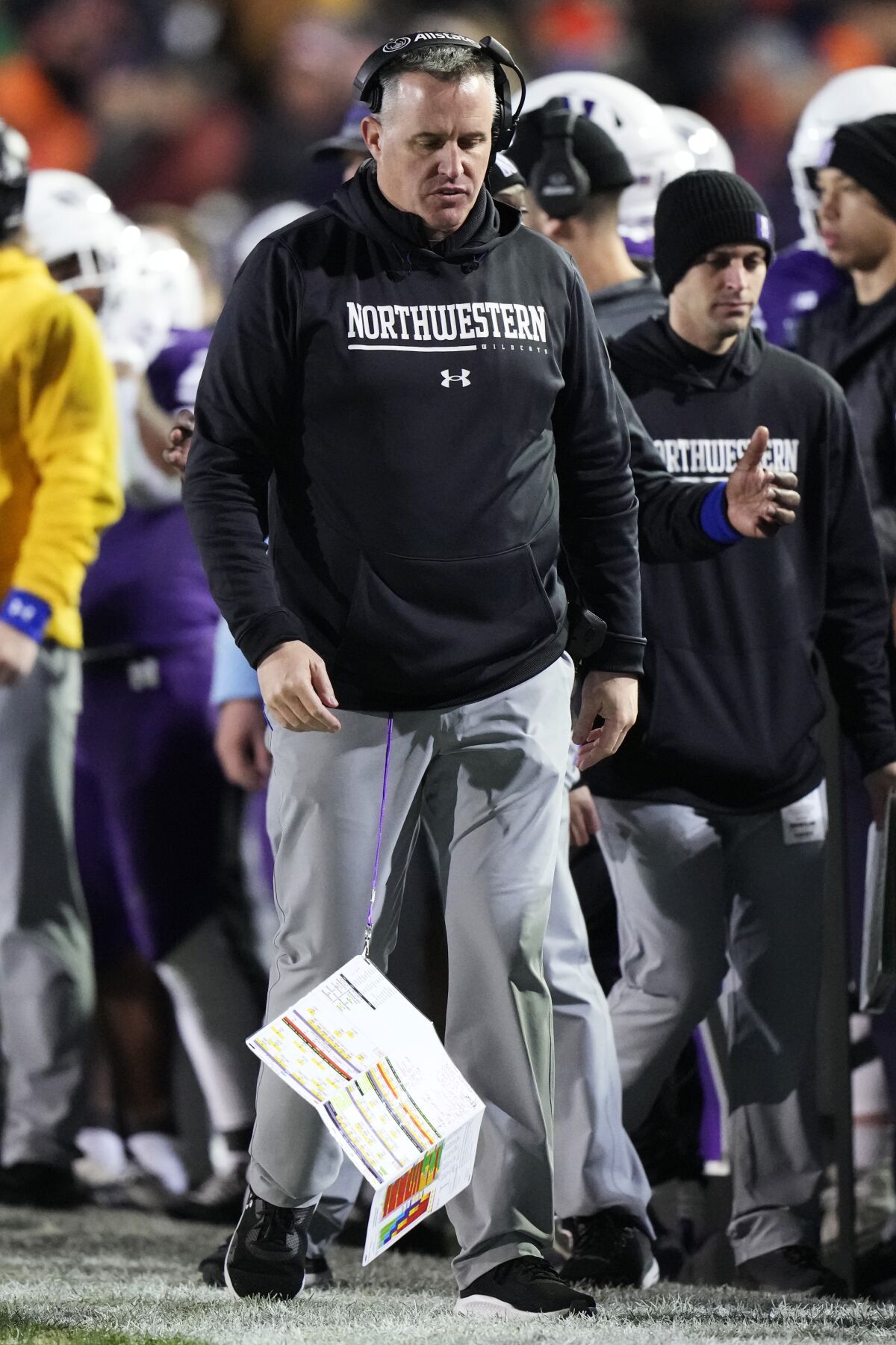 Northwestern head coach Pat Fitzgerald reacts as he looks down on the sideline during the second half of an NCAA college football game against Illinois in Evanston, Ill., Saturday, Nov. 26, 2022. Illinois won 41-3. (AP Photo/Nam Y. Huh)