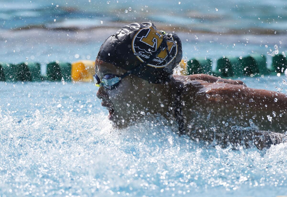Fountain Valley's Kaitlyn Nguyen swims to an easy championship win in the girls' 200 IM during the Surf League swim finals.