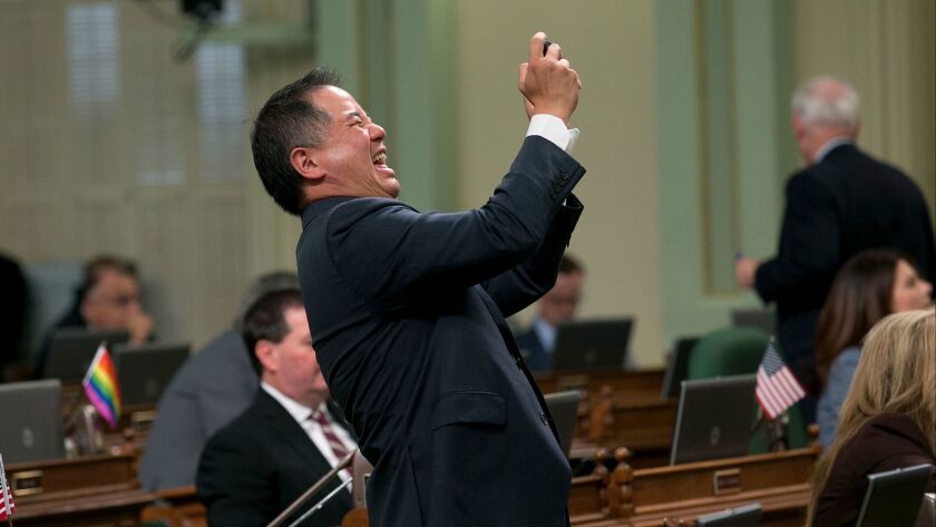 Assemblyman Phil Ting (D-San Francisco) celebrates passage of the state budget on June 15.