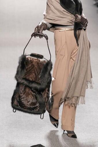Fur has been a perennial on the fall-winter runways for several years. So this season, designers had to use it more creatively to get attention. Here, a model carries a fur-covered grocery cart down the runway during the Jean Paul Gaultier fall-winter 2011 runway show.