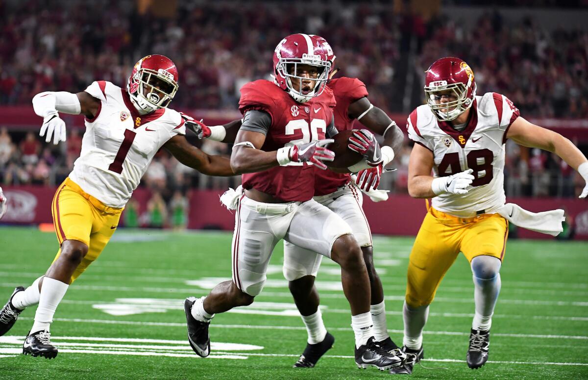 Alabama's Humphrey Marlon intercepts a pass in front of USC receivers Darreus Rogers, left, and Taylor McNamara in the second quarter on Sept. 3, 2016.