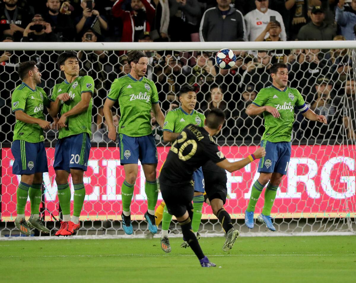 LAFC's Eduard Atuesta scores against the Seattle Sounders in the first half Tuesday.
