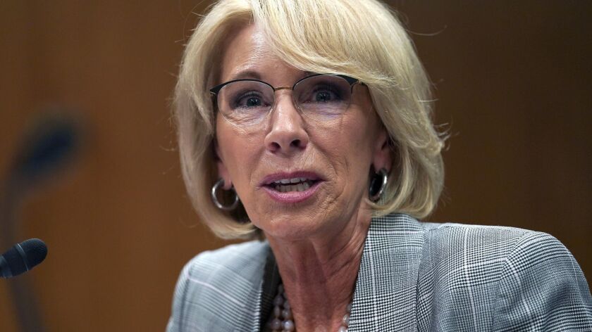 Education Secretary Betsy DeVos testifies during a hearing on Capitol Hill in June.