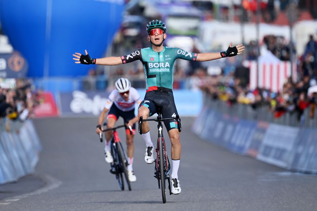 Lennard Kamna celebrates after crossing the finish line of the fourth stage of the Giro D'Italia cycling race from Avola to Etna-Nicolosi, Italy, Tuesday, May 10, 2022. (Massimo Paolone/LaPresse via AP)