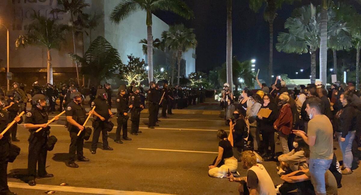 A series of standoffs between protesters and police at a rally at South Coast Plaza late Monday night.