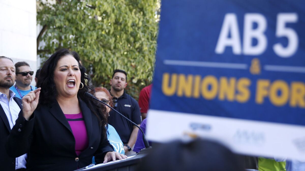 Assemblywoman Lorena Gonzalez (D-San Diego) speaks at a rally for AB 5.