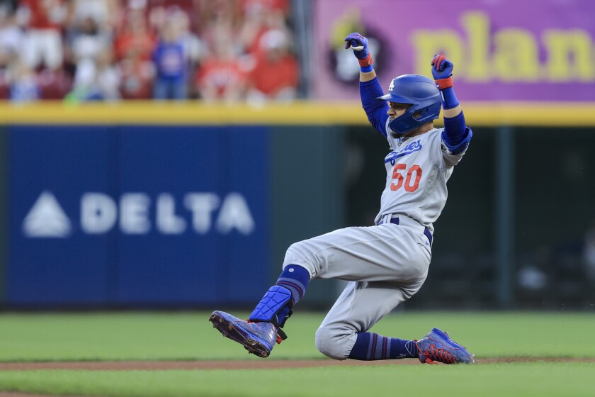 Mookie Betts slides into second base after hitting a leadoff double in the first inning Friday.
