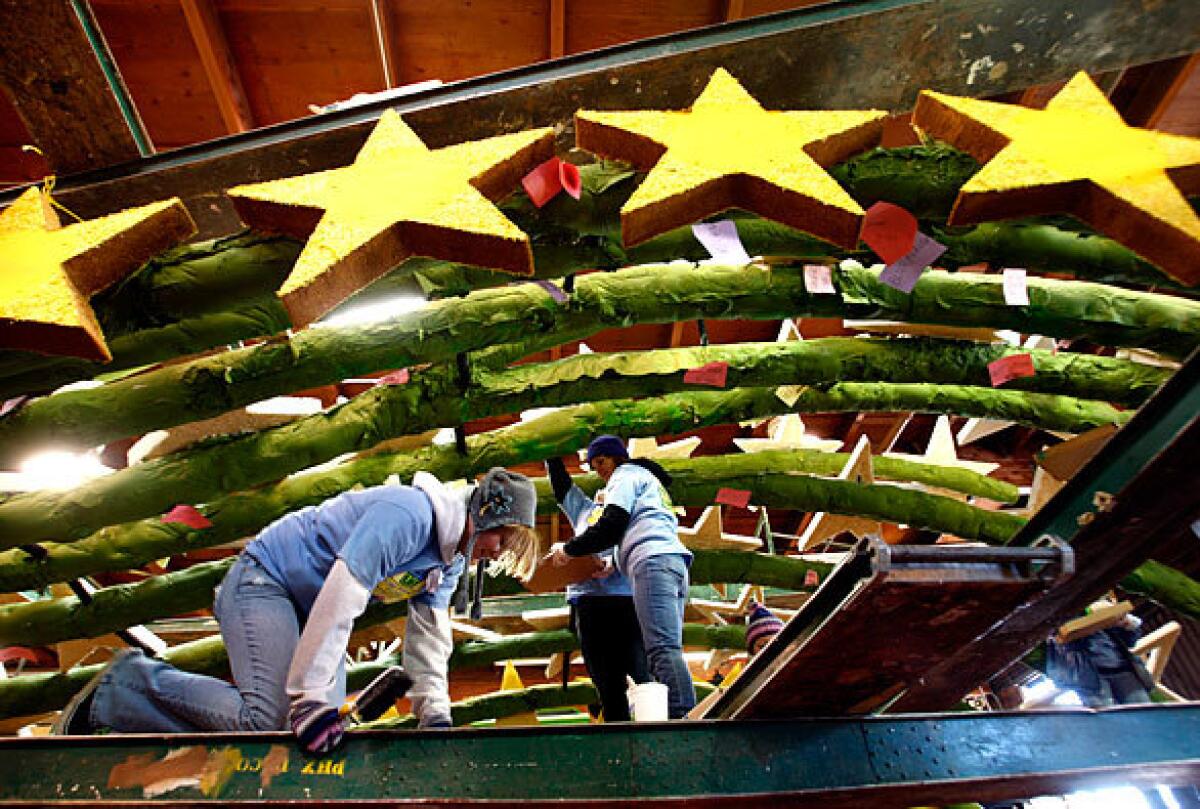 Volunteers work on the Donate Life float in Pasadena in preparation for the 2009 Rose Parade on New Year's Day. Crews are attending to detail work in readying floats for the once-a-year event. The theme of the parade is "Hats Off to Entertainment."