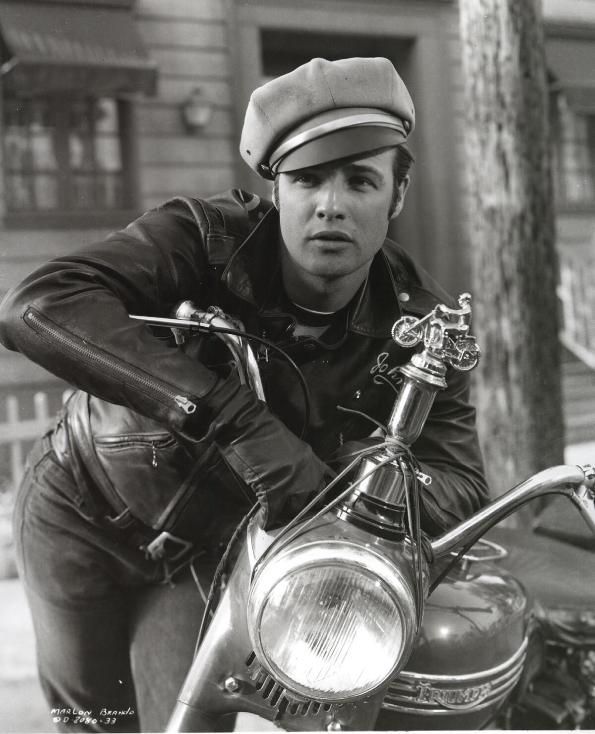 A young Marlon Brando in a leather jacket and on a motorcycle