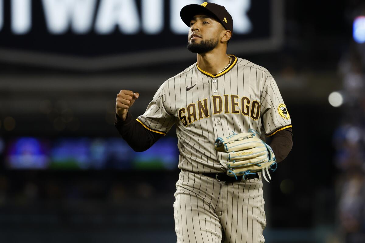 Blossoming Robert Suarez holds the line in Padres' win - The San Diego  Union-Tribune