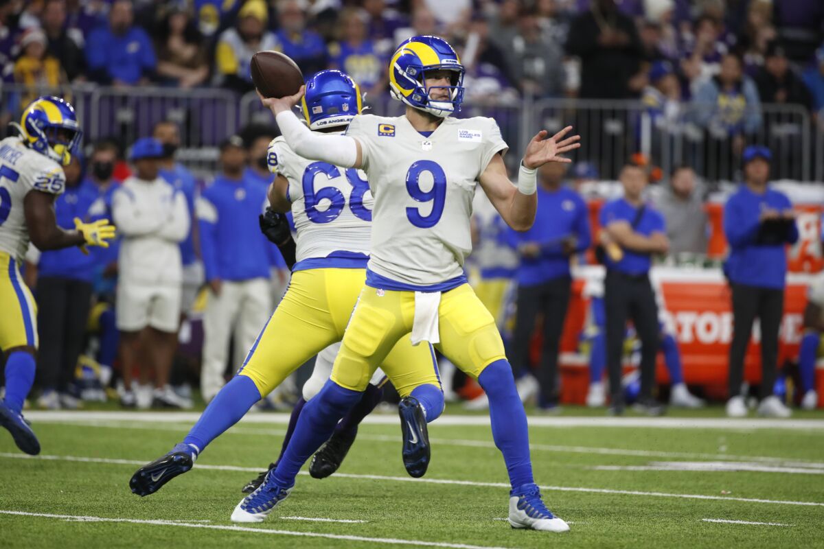 Rams quarterback Matthew Stafford (9) throws a pass during the first half against the Minnesota Vikings.