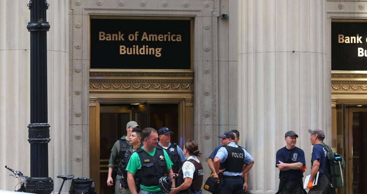 Police investigate a shooting on the 17th floor at 231 South LaSalle Street in Chicago on Thursday. One man was killed and another wounded in the incident, which is still being investigated.