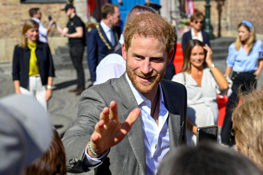 Prince Harry, Duke of Sussex, talks with wellwishers as he leaves the city hall in Duesseldorf, western Germany, where he was received on September 6, 2022 in the context of the "One Year to Go" event of the Invictus Games Duesseldorf 2023. The Duke of Sussex is the founder and patron of the Invictus Games Foundation. - The Duke of Sussex is the founder and patron of the Invictus Games Foundation. The 2023 edition of the Invictus Games, an international multi-sport event for wounded, injured and sick servicemen and women, both serving and veterans, will take place from September 9 to 16, 2023. (Photo by Sascha Schuermann / AFP) (Photo by SASCHA SCHUERMANN/AFP via Getty Images)