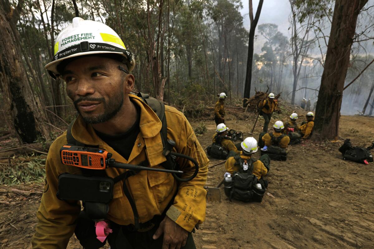 Leonard Dimaculangan, 41, of Pasadena, Calif/, is captain of the Texas Canyon hotshot firefighters based in the Angeles National Forest. In Australia, he leads a group of American firefighters in the Alpine National Park, near Mt. Buffalo.