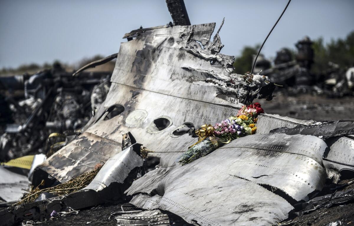 Much of the wreckage of Malaysia Airlines Flight 17, seen in this July 26, 2014, photo from the crash site in eastern Ukraine, has been taken to a Dutch air base and reconstructed to aid investigators in their search for the cause and perpetrators of the disaster.