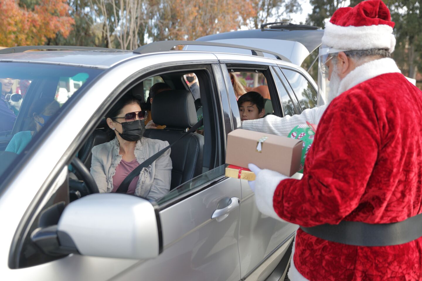 Santa greets a client with AniMeals gifts