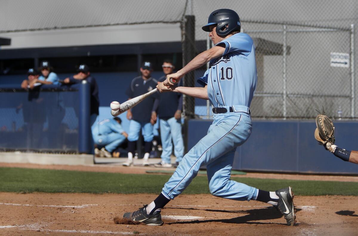 Corona del Mar High's Carter Haight makes contact against Marina in the third inning of a Wave League game at Corona del Mar on Wednesday.