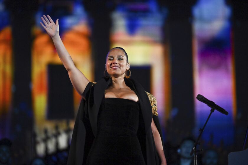 Alicia Keys performs at the Platinum Jubilee concert taking place in front of Buckingham Palace, London, Saturday June 4, 2022, on the third of four days of celebrations to mark the Platinum Jubilee. The events over a long holiday weekend in the U.K. are meant to celebrate Queen Elizabeth II’s 70 years of service. (Jeff J Mitchell /Pool photo via AP)