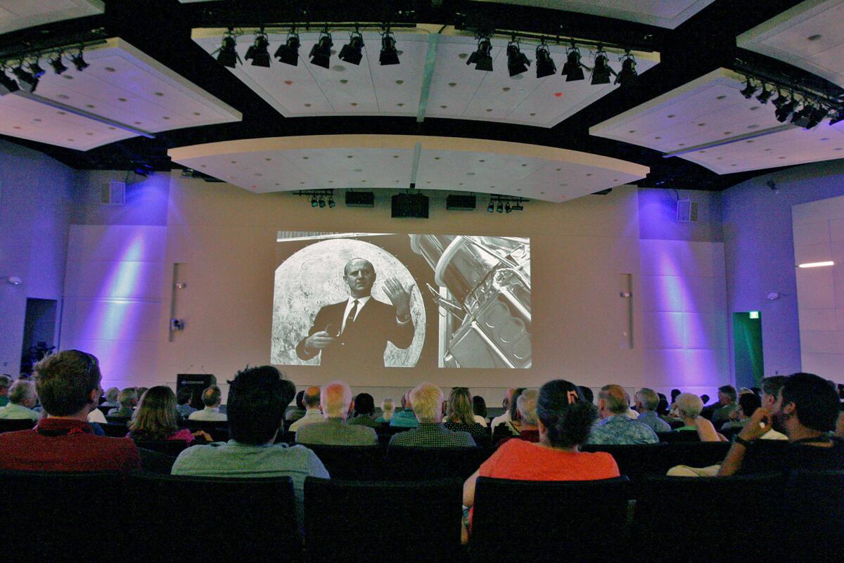 Attendees view a video of the late William Pickering at the dedication of the Pickering Auditorium at NASA's Jet Propulsion Laboratory on Monday, July 27, 2015. Pickering was the director of JPL for 22 years, from 1954 to 1976, and is credited with the motivation and execution of deep space exploration.