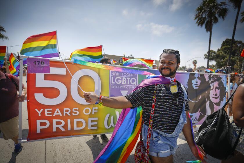 Charlie Ibara walks with the North County LGBTQ Resource Center contingent during the annual San Diego Pride Parade.