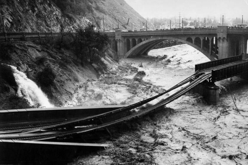 March 2, 1938: Floodwaters in Los Angeles River destroy Southern Pacific railroad bridge. 