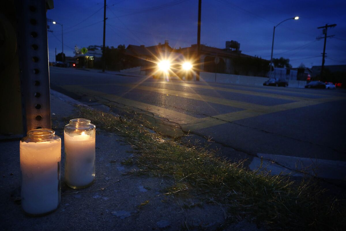 Candles mark the crosswalk in Boyle Heights where Raquel Diaz, a nun, was critically injured when she was struck by a hit-and-run driver. Diaz died Sunday.