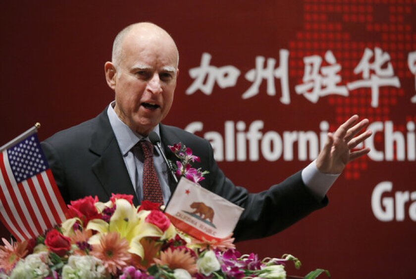 Gov. Jerry Brown, while on his weeklong swing through China, says his administration will come up with a plan for reducing the state prison population.