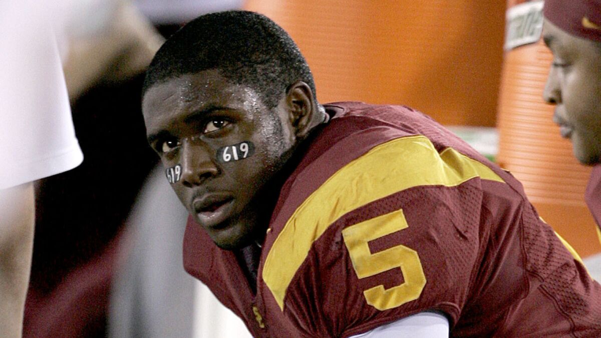 USC's Reggie Bush looks on from the bench during a game against Fresno State in November 2005. Bush's relationship with would-be sports marketers Michael Michaels and Lloyd Lake was the focus of an NCAA investigation.