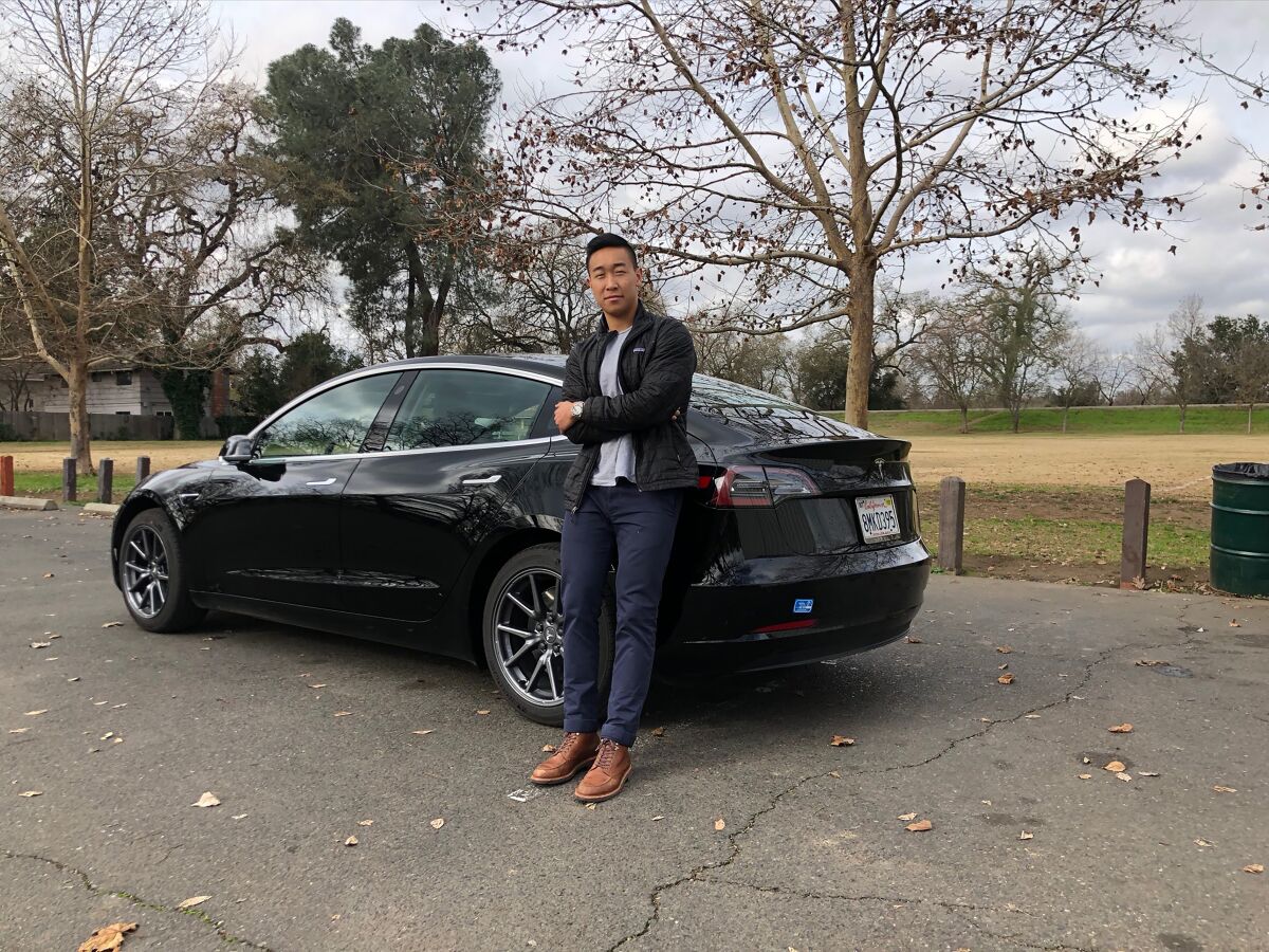 Ethan Dang and his 2019 Tesla Model 3.