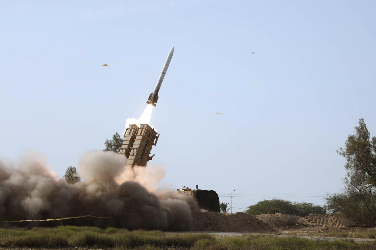 A missile is launched during a military drill in southern Iran. 