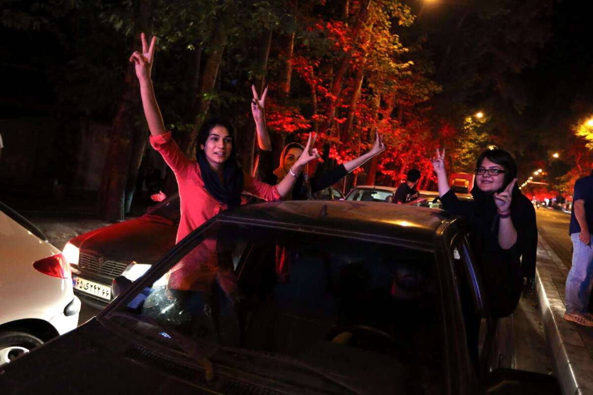 Iranians celebrate in northern Tehran on July 14 after their nation's nuclear negotiating team struck a deal with world powers in Vienna.