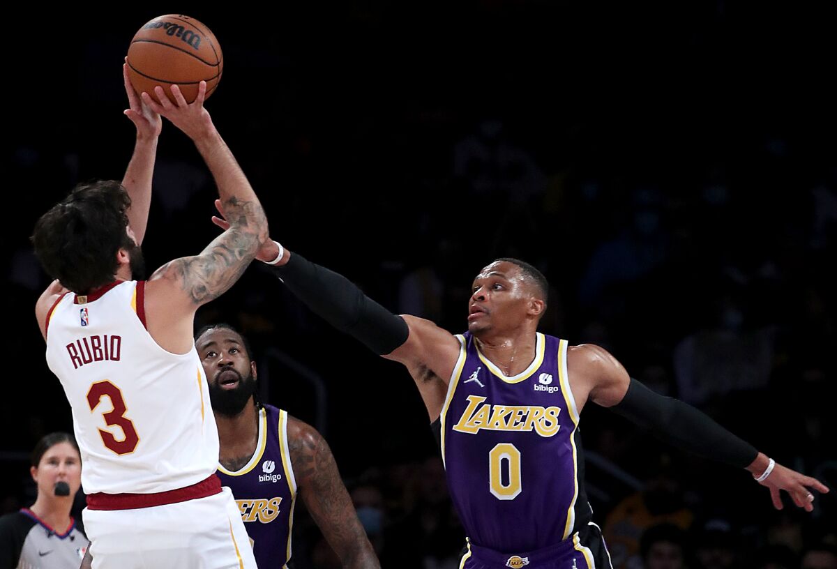 Cleveland Cavaliers guard Ricky Rubio shoots over Lakers guard Russell Westbrook in the first quarter.