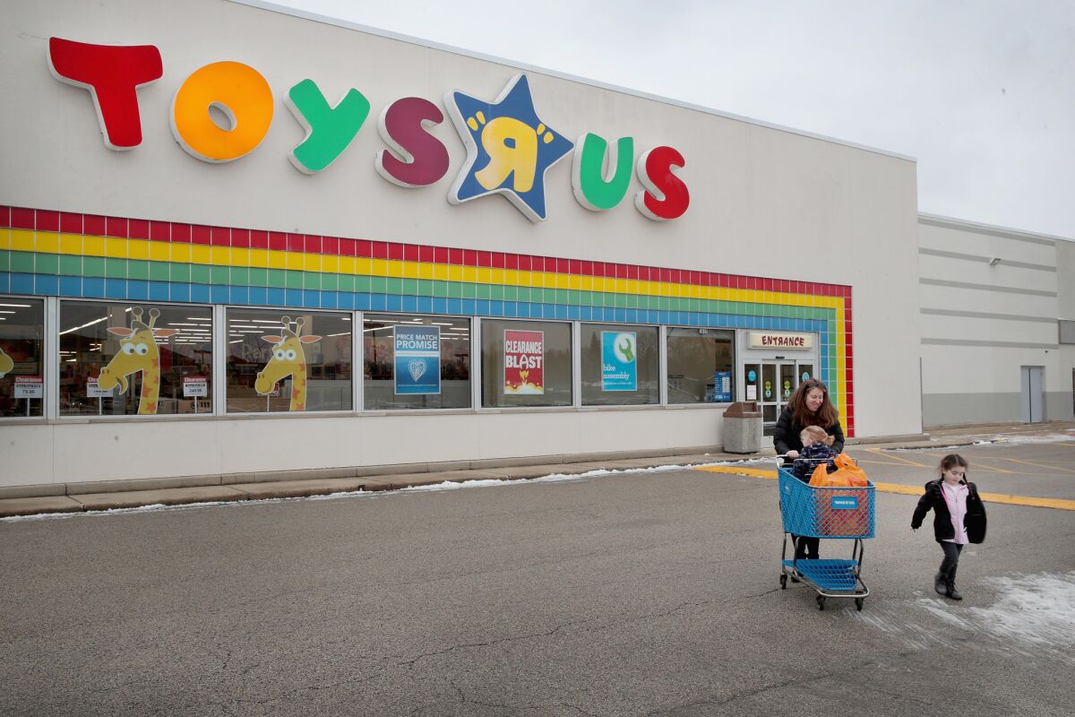 Customers shop at a Toys R Us store on Jan. 24, 2018, in Highland Park, Ill. 