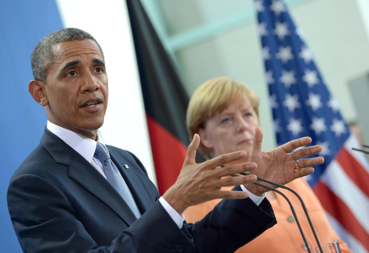 President Obama speaks at a joint news conference with German Chancellor Angela Merkel in Berlin.