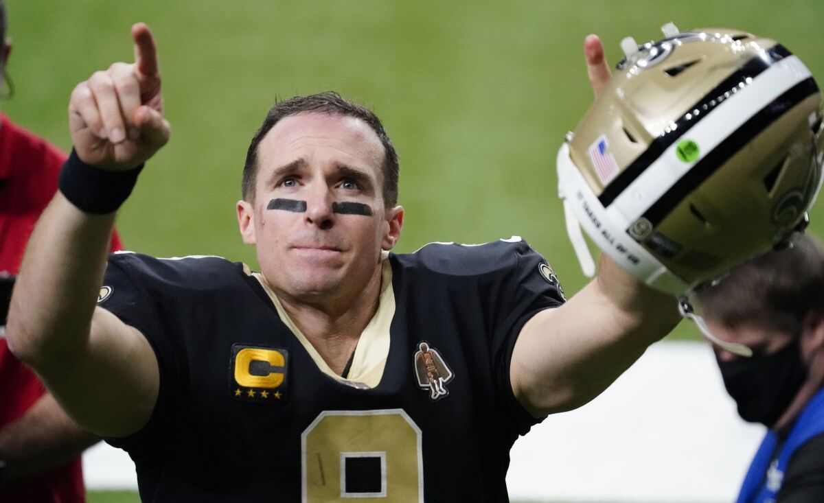 New Orleans Saints quarterback Drew Brees points to family and fans.