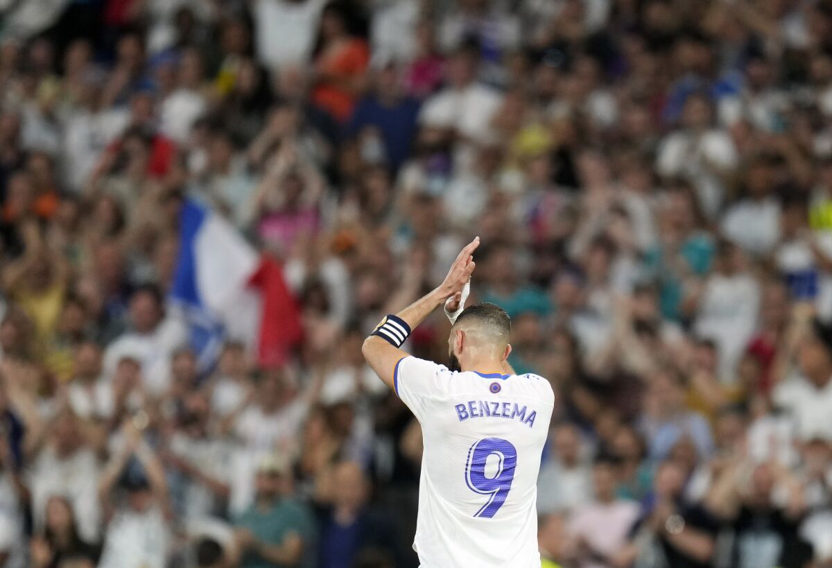 Real Madrid's Karim Benzema leaves the field during a Spanish La Liga soccer match between Real Madrid and Levante at the Santiago Bernabeu stadium in Madrid, Thursday, May 12, 2022. (AP Photo/Manu Fernandez)