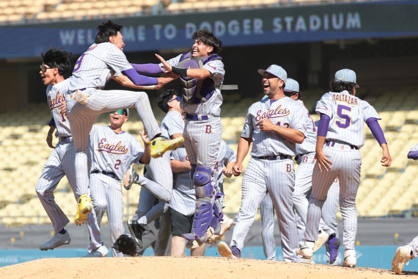 LOS ANGELES, CALIFORNIA May 25, 2024- Bell celebrates after defeating Birmingham in the City Section Open Division championship at Dodger Stadium Saturday. (Wally Skalij/Los Angeles Times)