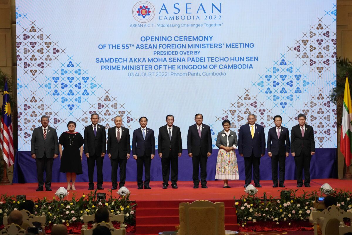 From left to right; Malaysian Foreign Minister Saifuddin Abdullah, Philippines Foreign Affairs acting Undersecretary Theresa Lazaro, Singapore Foreign Minister Vivian Balakrishnan, Thailand's Foreign Minister Don Pramudwinai, Vietnam Foreign Minister But Thanh Son, Cambodia's Prime Minister Hun Sen, Cambodia's Foreign Minister Peak Sokhonn, Indonesia's Foreign Minister Retno Marsudi, Brunei Second Minister of Foreign Affair Erywan Yusof, Laos Foreign Minister Saleumxay Kommasith, and Secretary-General of ASEAN Lim Jock Hoi poses for a group photograph during the opening for the 55th ASEAN Foreign Ministers' Meeting (55th AMM) in Phnom Penh, Cambodia, Wednesday, Aug. 3, 2022. (AP Photo/Heng Sinith)