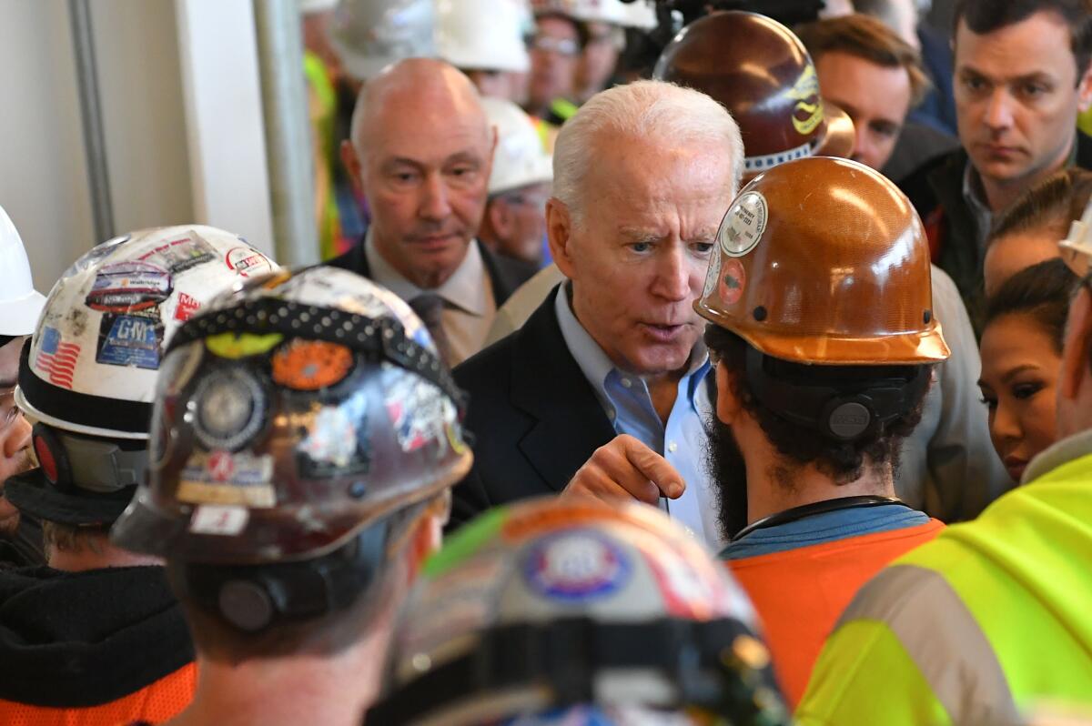 Democratic presidential candidate Joe Biden had a heated confrontation over gun rights as he toured the Fiat Chrysler plant in Detroit ahead of Tuesday’s Michigan primary.