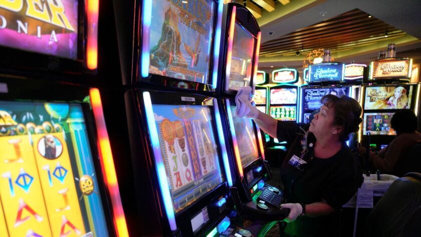 From communion cups to slot machines, flu drives caution in shared spaces -  The San Diego Union-Tribune