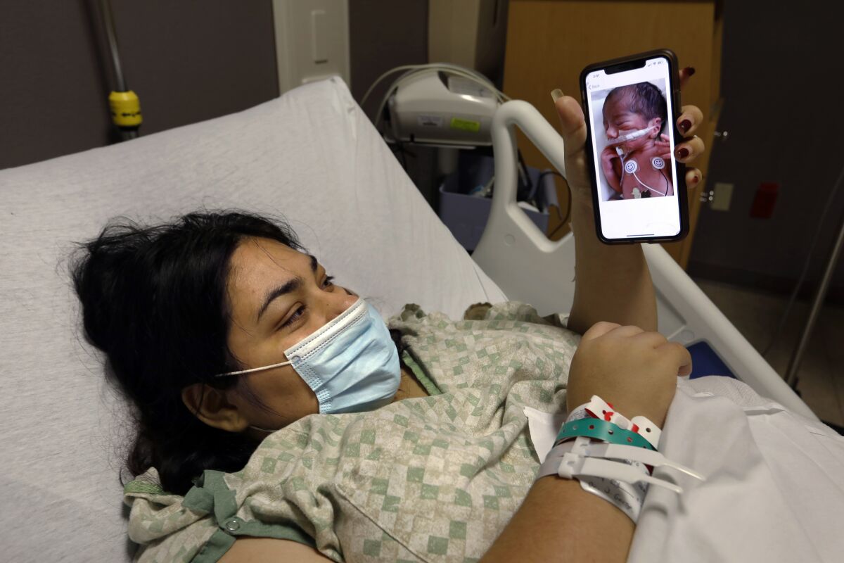 Mayra Vega, who tested positive while pregnant, is isolated from her son, born prematurely. The nurses took photos of him.