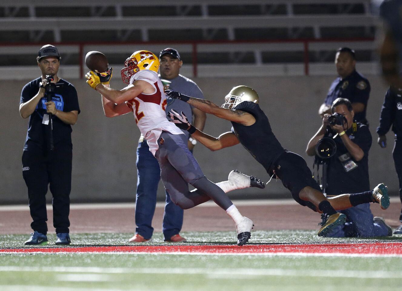 Mission Viejo efensive back Ryan Kennedy intercepts intended for Poly wide receiver Jalen Hall late in the fourth quarter.